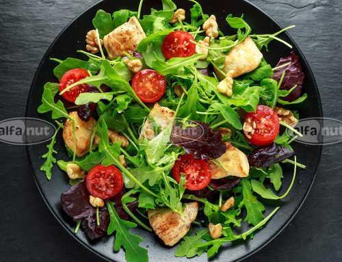 Fresh salad with chicken breast, arugula, nuts & cherry tomatoes